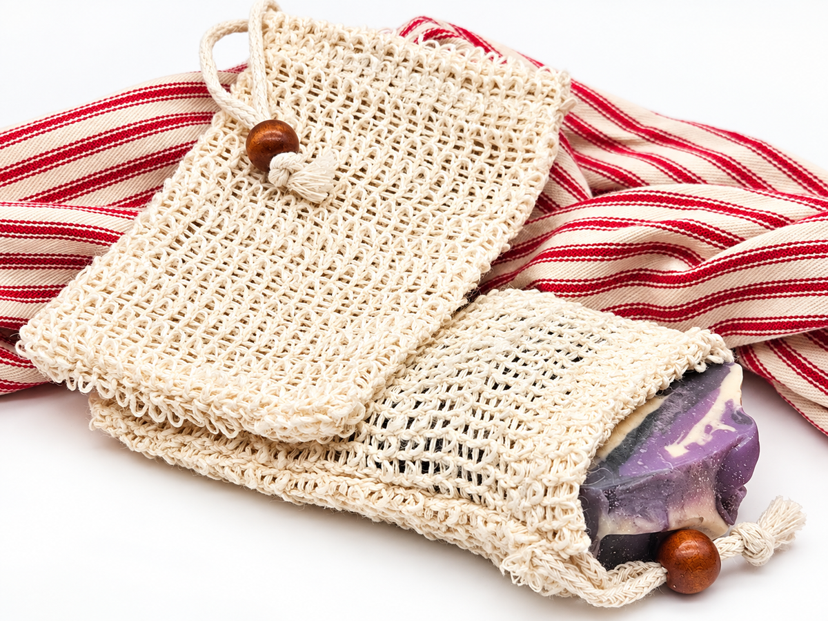 Natural sisal soap saver pouches with a purple handmade soap bar